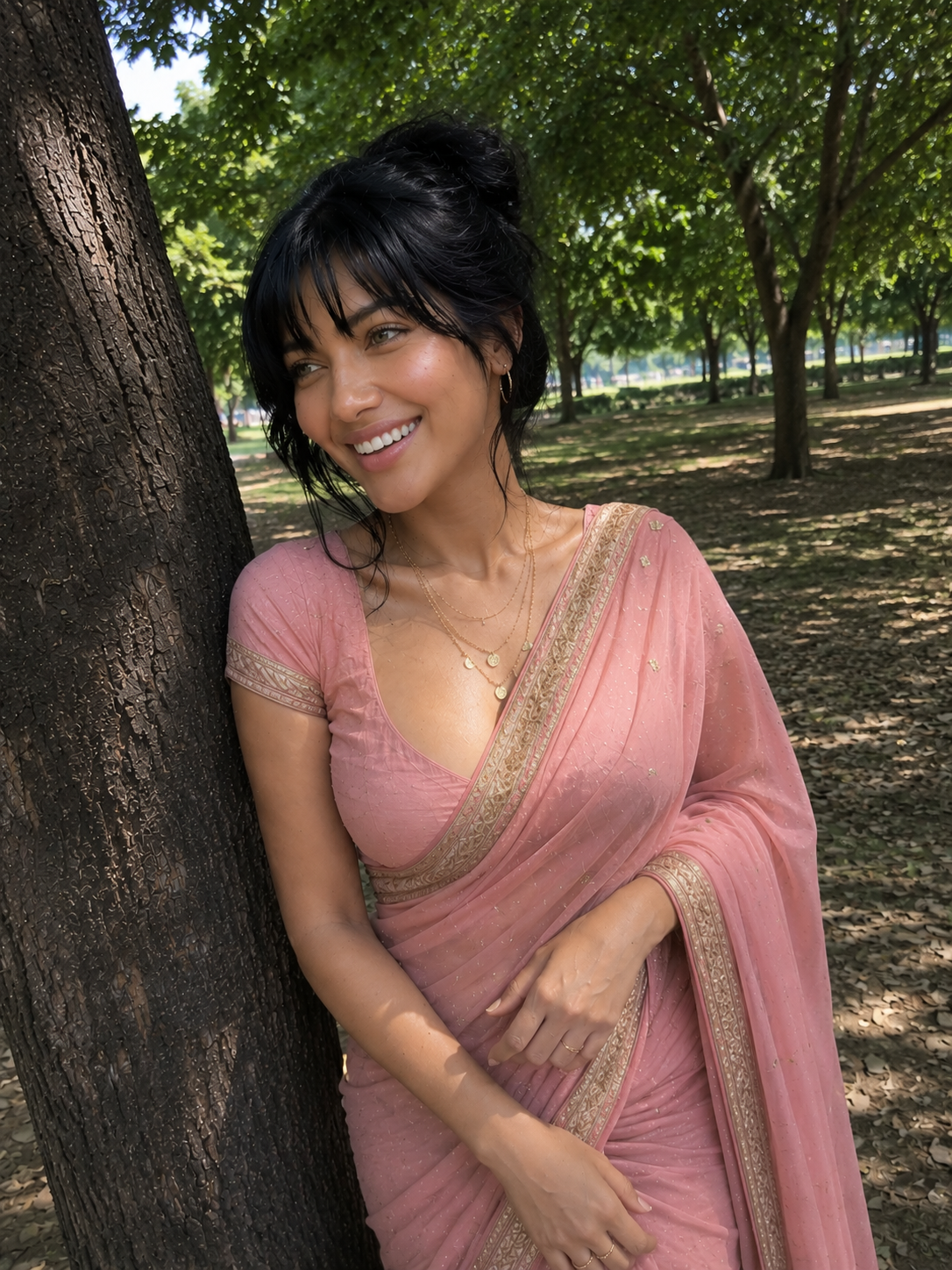 Neha Buxy in a blush saree in a green outdoor setting.